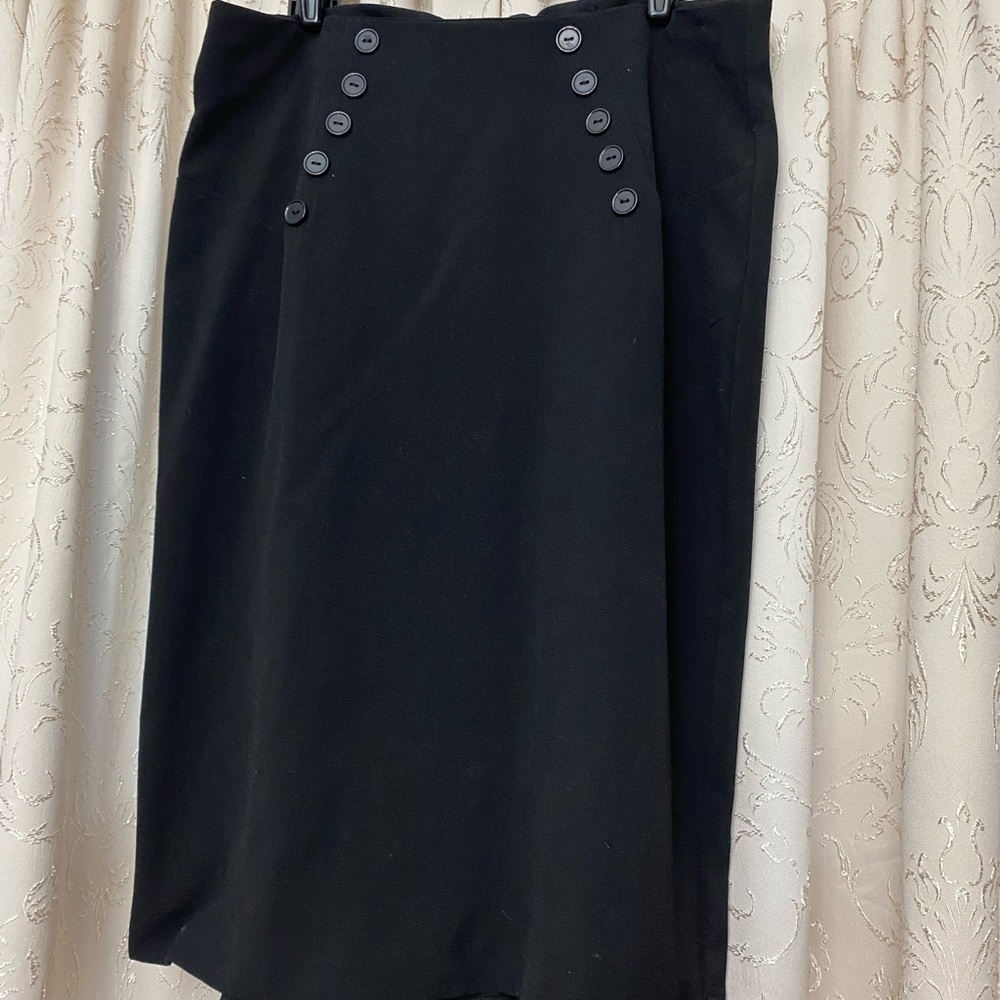 B. Wear black skirt with detailed buttons